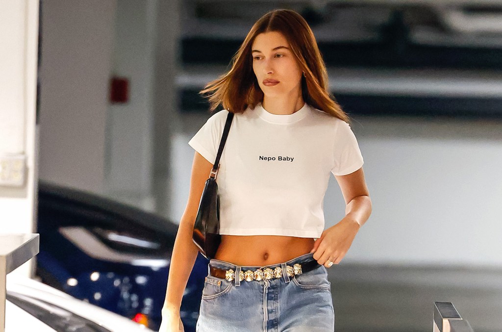 After hailey bieber stepped out in a nepo baby t shirt the internet is calling it a slay among other reactions