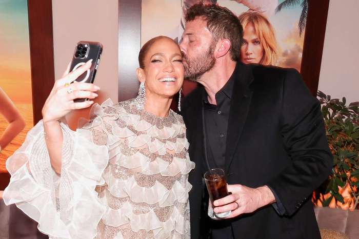 Jennifer lopez rocked the shotgun wedding premiere in a knockout see through dress with a yellow bow underneath