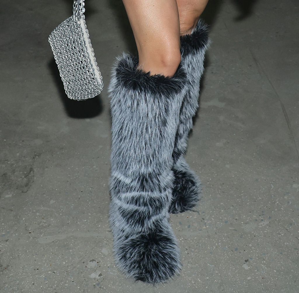 Julia fox wears nothing but belts boots and a coat at milan fashion week
